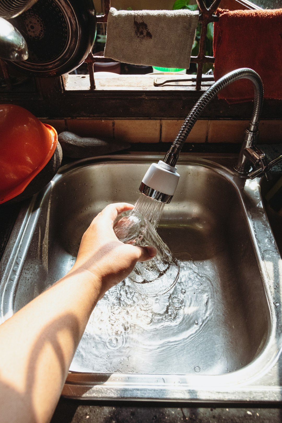 a-hand-holding-a-water-bottle-y3ejqthwaio