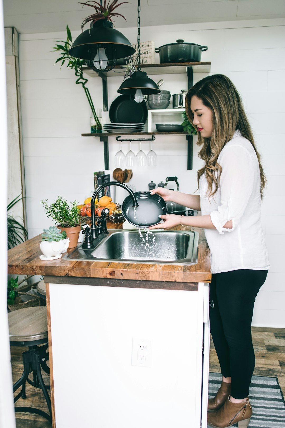 woman-wearing-white-blouse-washing-dish-on-the-faucet-8hwo-w-5vfu